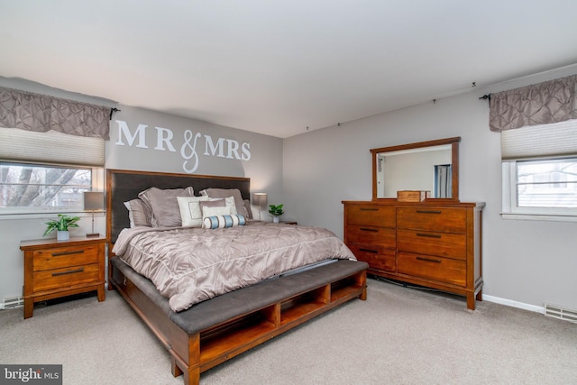 bedroom featuring light colored carpet