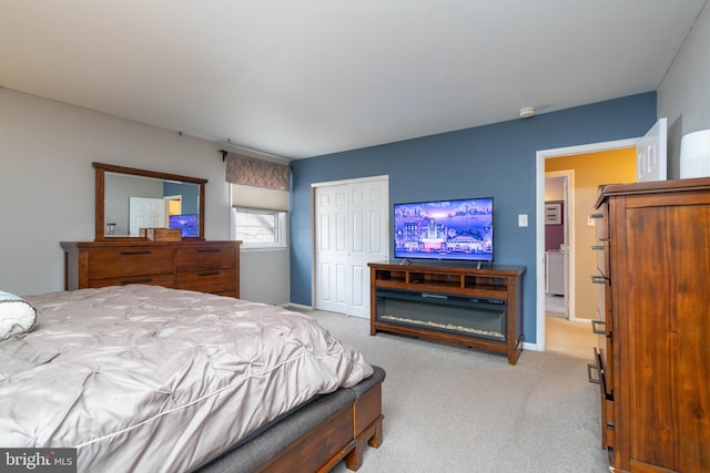 carpeted bedroom with a closet