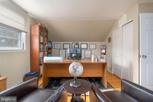 office featuring light hardwood / wood-style flooring and lofted ceiling