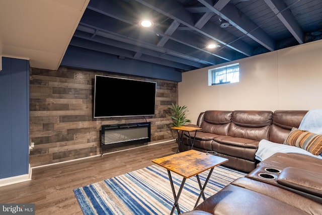 living room with hardwood / wood-style flooring, beam ceiling, and wooden walls