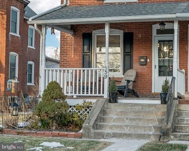 property entrance with a porch