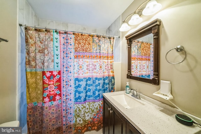 bathroom with vanity and a shower with shower curtain