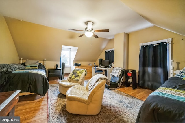 bedroom with vaulted ceiling, ceiling fan, and hardwood / wood-style floors