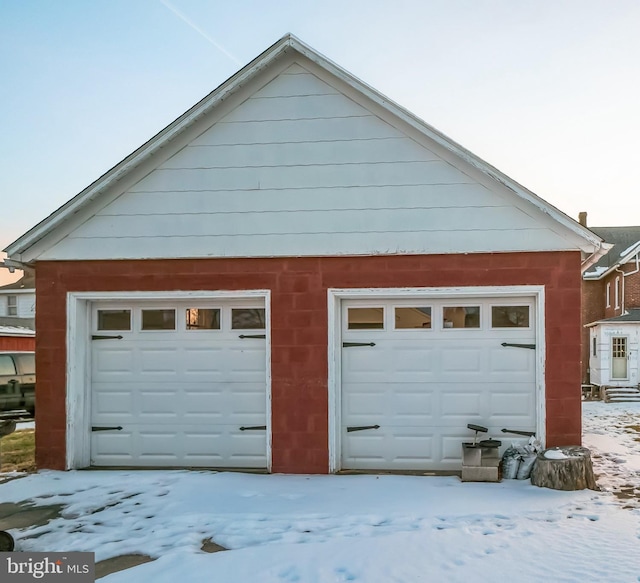 view of snow covered garage