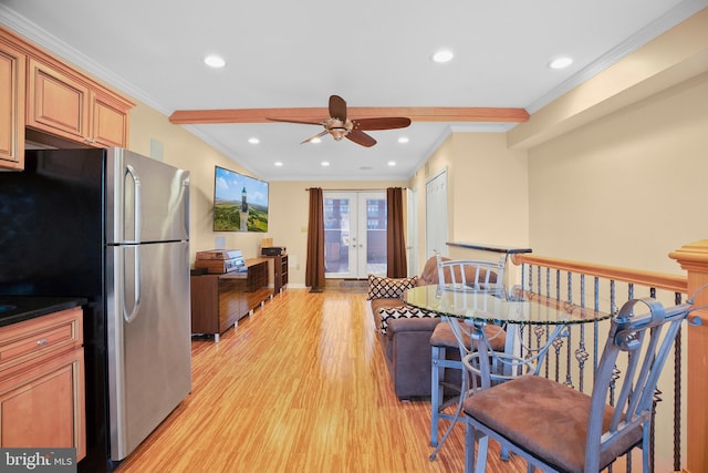 kitchen with stainless steel refrigerator, ornamental molding, light hardwood / wood-style floors, and french doors