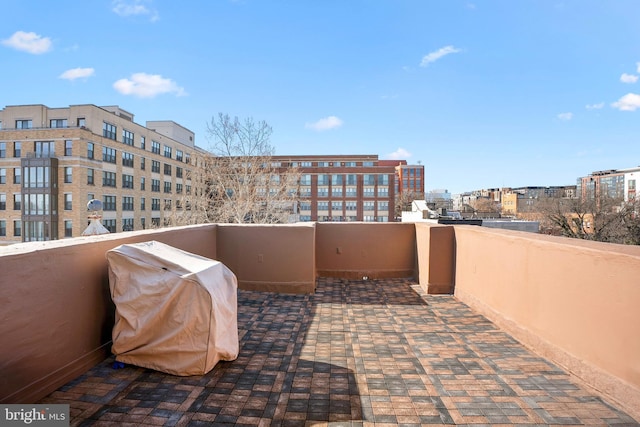 view of patio / terrace with a grill and a balcony