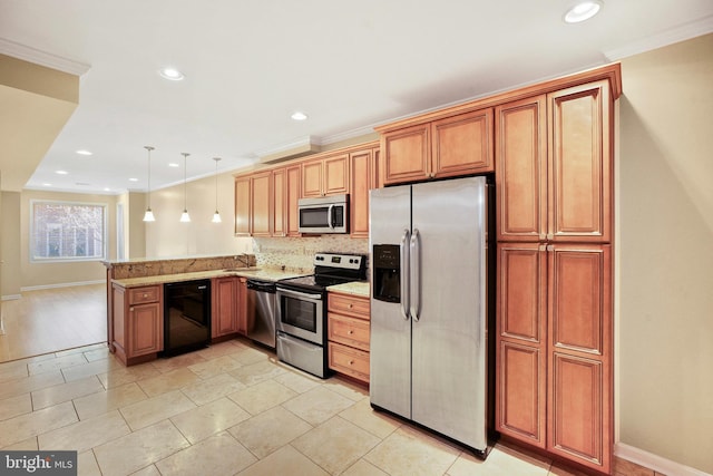 kitchen with appliances with stainless steel finishes, light stone counters, ornamental molding, decorative light fixtures, and kitchen peninsula