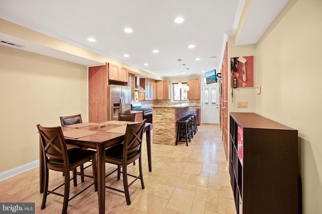 dining area featuring ornamental molding