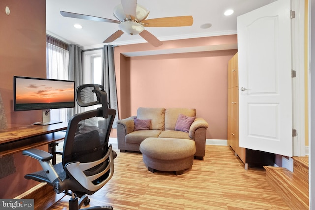 office area with crown molding, light hardwood / wood-style flooring, and ceiling fan