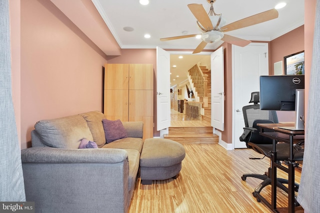 office area featuring crown molding, light hardwood / wood-style flooring, and ceiling fan