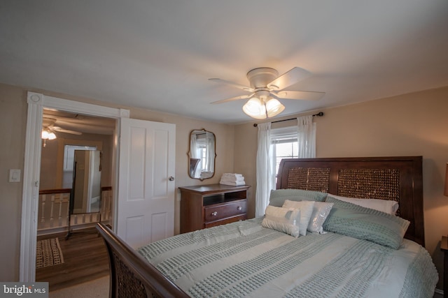 bedroom with hardwood / wood-style flooring and ceiling fan