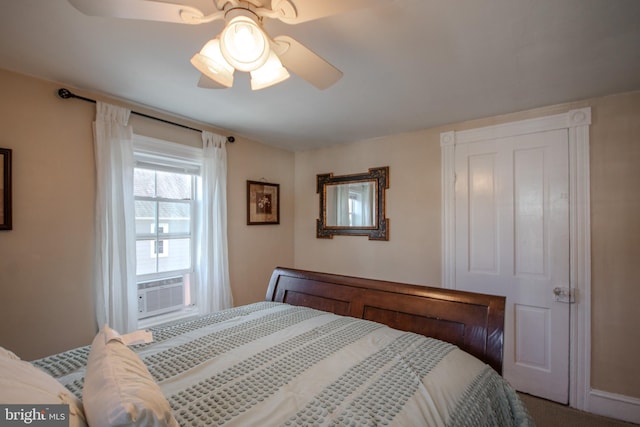 bedroom with cooling unit and ceiling fan