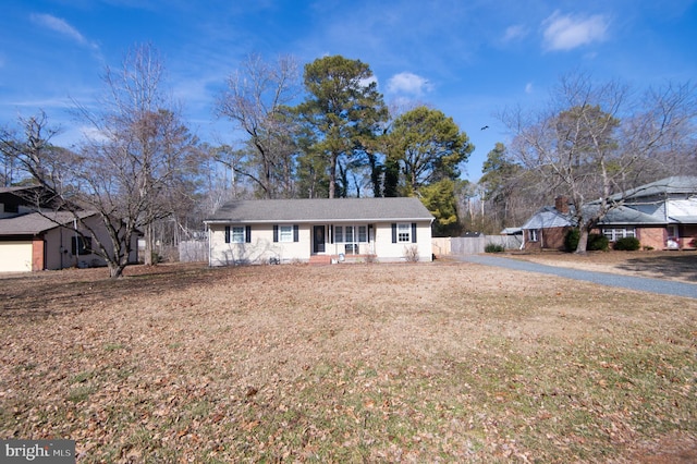 ranch-style home with a front yard