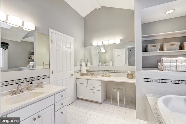 bathroom with lofted ceiling, backsplash, vanity, tiled tub, and tile patterned floors