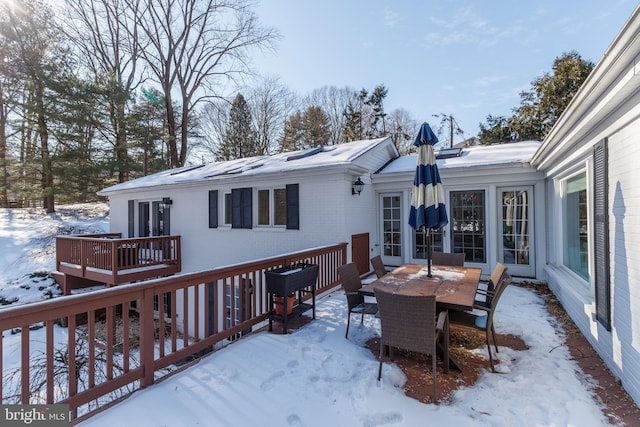 view of snow covered deck