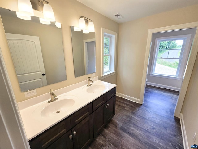 bathroom featuring vanity and hardwood / wood-style flooring