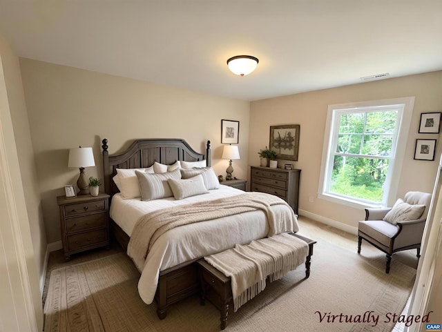 bedroom featuring light colored carpet