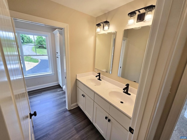 bathroom featuring vanity and hardwood / wood-style floors