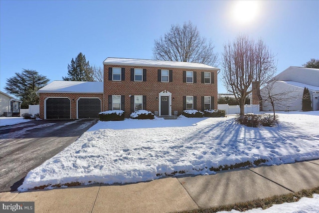 colonial inspired home featuring a garage