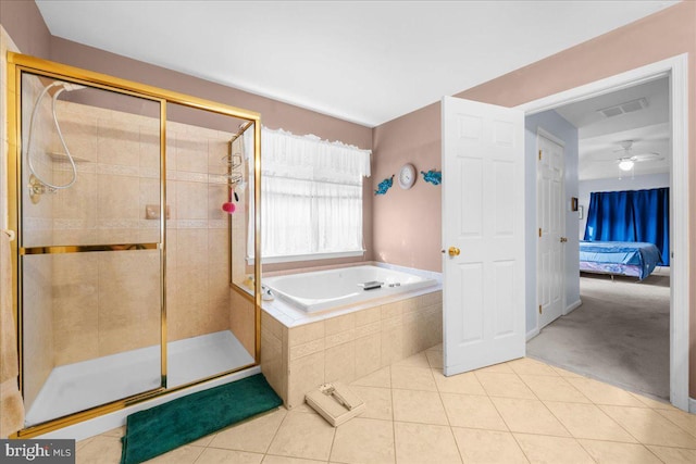 bathroom with separate shower and tub and tile patterned floors