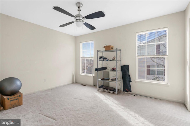 misc room with light carpet and ceiling fan