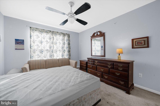 bedroom with light colored carpet and ceiling fan