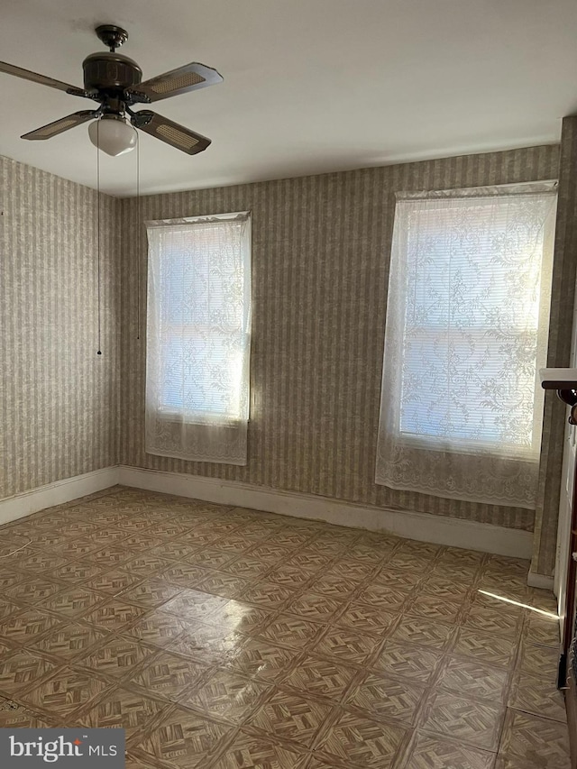 empty room featuring ceiling fan