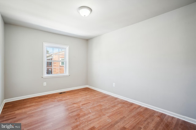 unfurnished room with light hardwood / wood-style floors