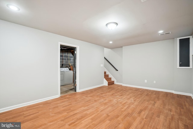 basement with light hardwood / wood-style floors