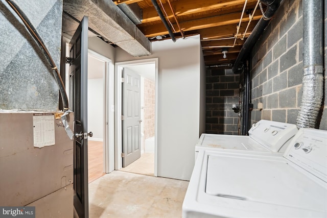 clothes washing area featuring washer and dryer