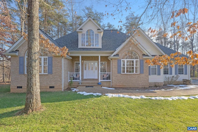 view of front of house with covered porch and a front yard