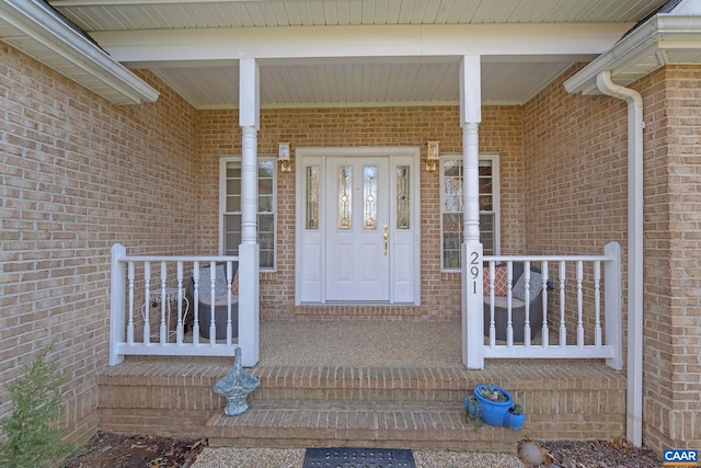 property entrance featuring covered porch