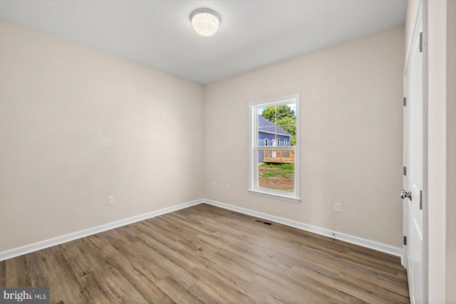 unfurnished room featuring light hardwood / wood-style flooring