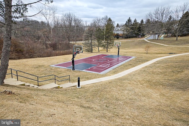 view of sport court featuring community basketball court and a yard