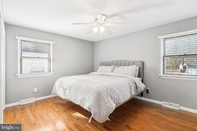 bedroom with hardwood / wood-style flooring and ceiling fan