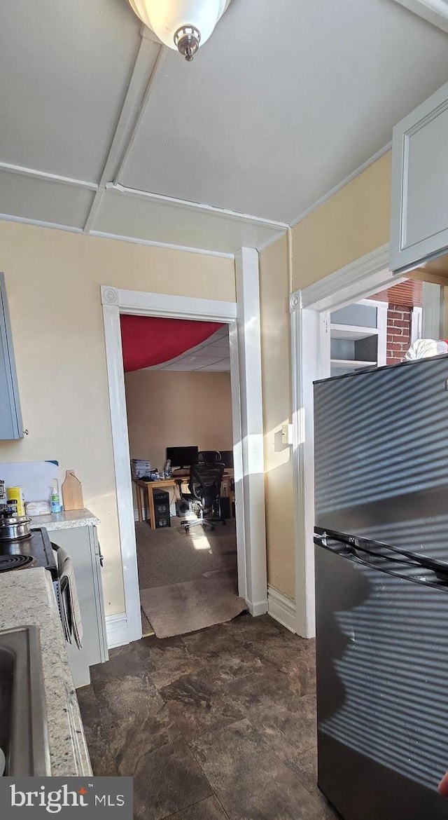 kitchen featuring black fridge