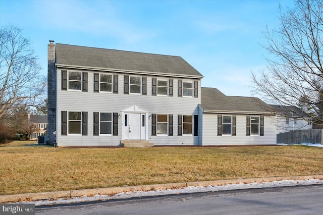 colonial inspired home with central AC and a front lawn