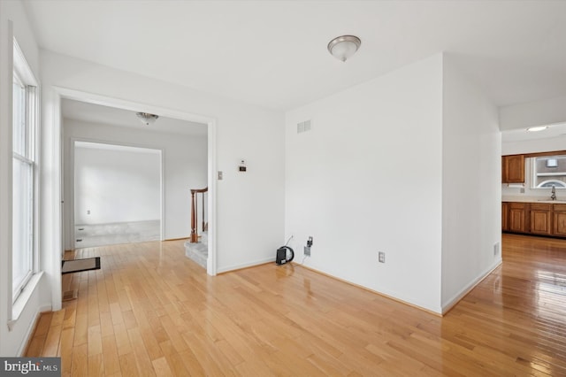 washroom featuring sink and light hardwood / wood-style floors