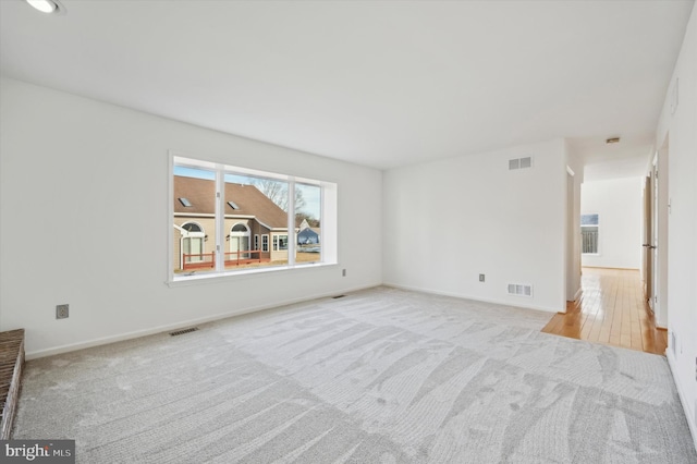 spare room with light colored carpet