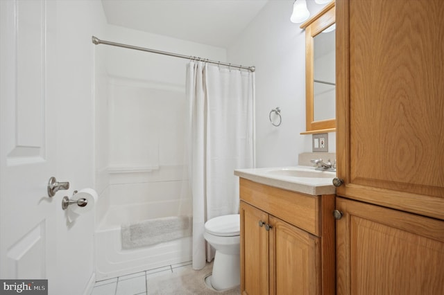 full bathroom featuring tile patterned flooring, vanity, toilet, and shower / bath combo with shower curtain