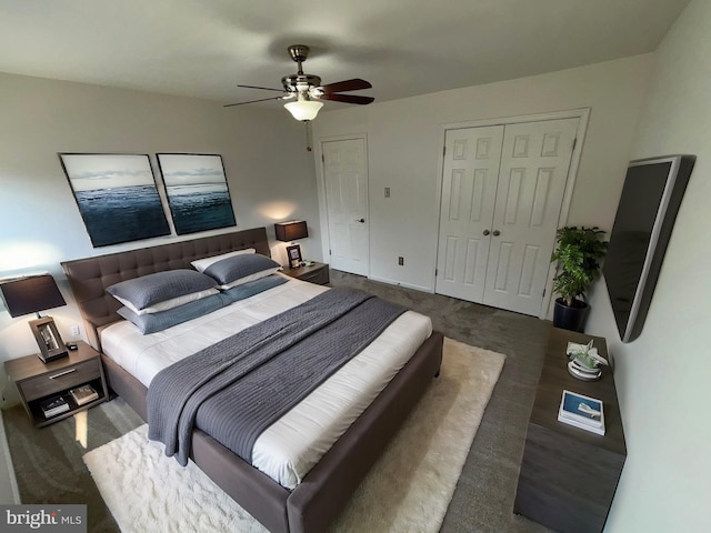 bedroom with ceiling fan and dark carpet