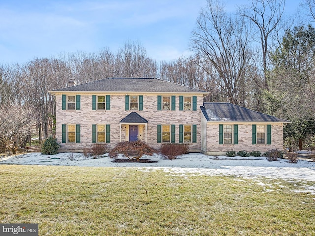 view of front of house with a yard