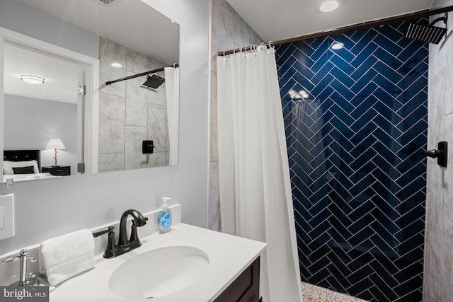 bathroom with vanity and walk in shower