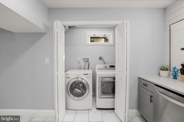 clothes washing area with independent washer and dryer