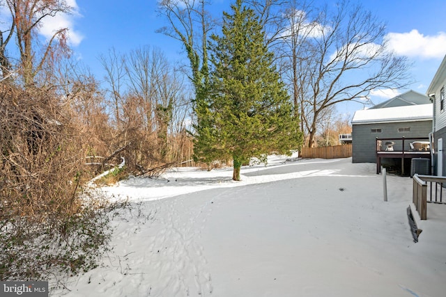 view of yard layered in snow