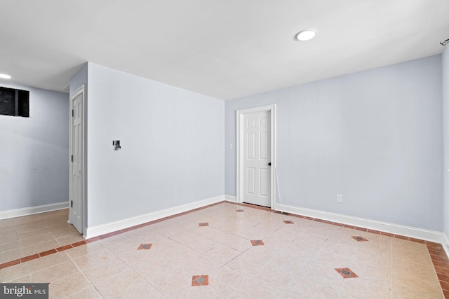 spare room with light tile patterned floors