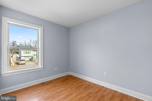 empty room with light wood-type flooring