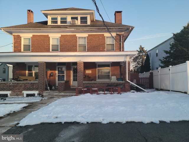 view of front of home featuring cooling unit and covered porch