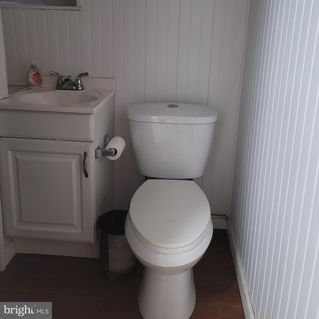 bathroom featuring vanity and toilet