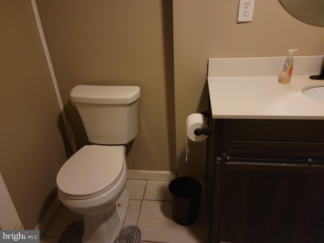 bathroom with tile patterned floors, vanity, and toilet